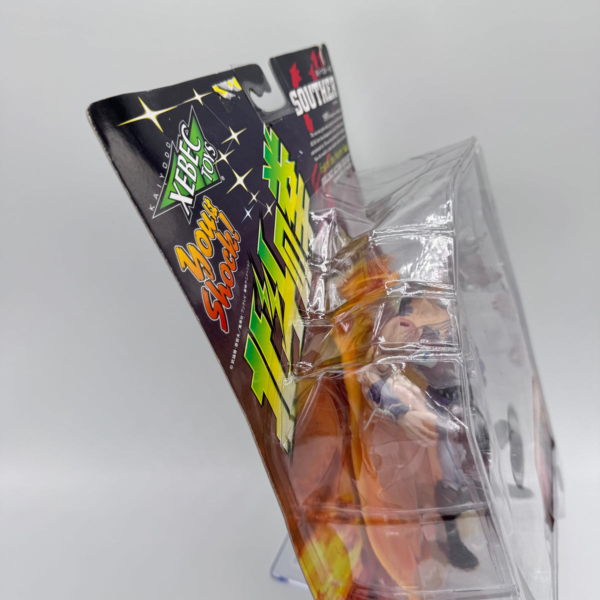 Souther action figure side view showing card warp