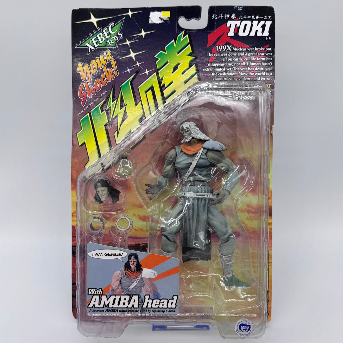 Toki action figure front in blister pack with Amiba head
